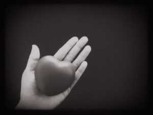 heart in hand black and white photo NKGNLGS n